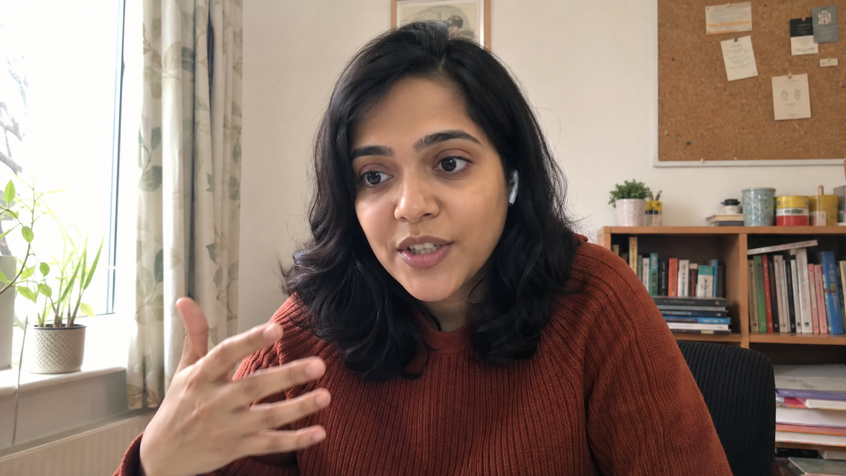 Fictional dating coach Priya listening during a coaching call